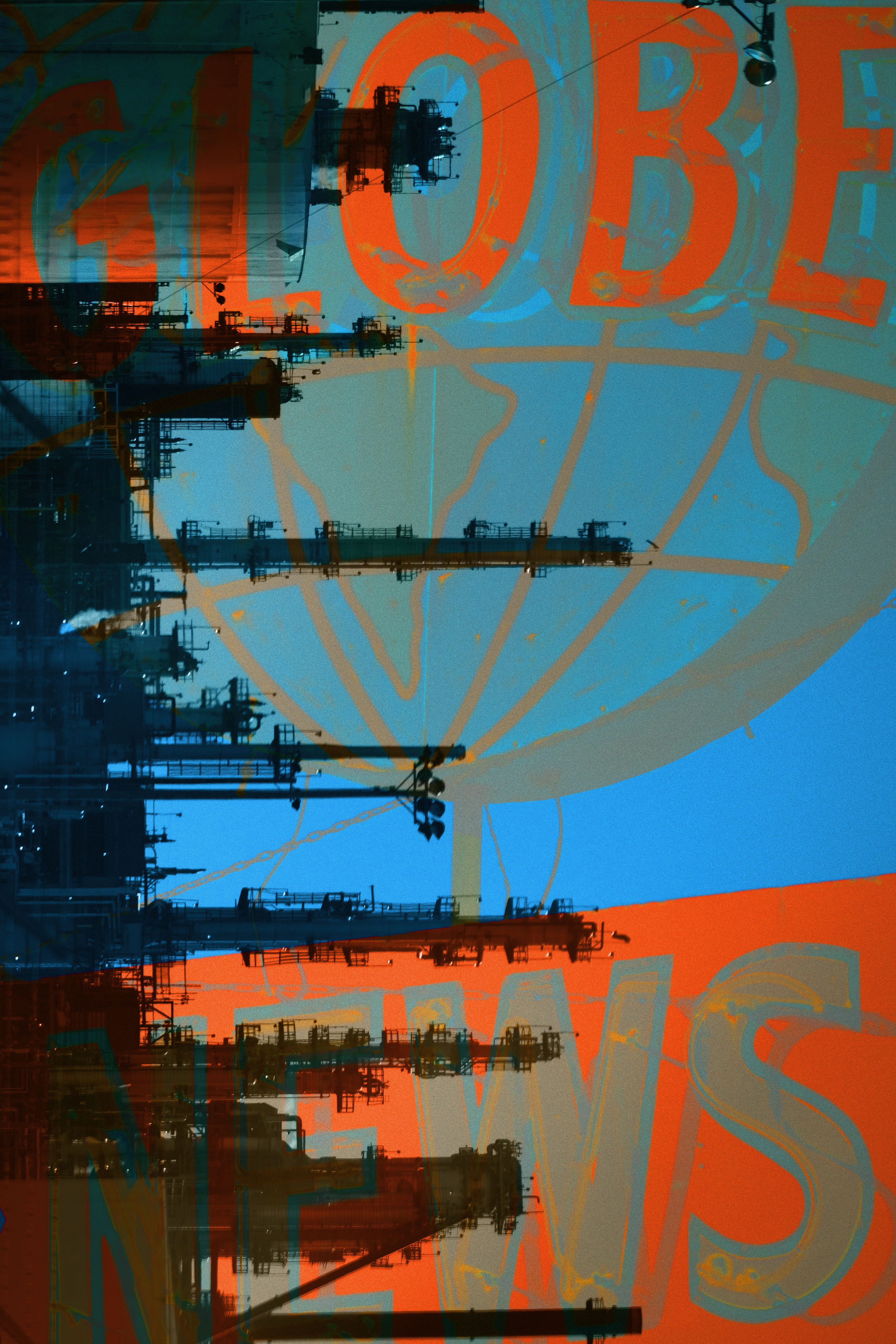 Globe news sign over oil refinery