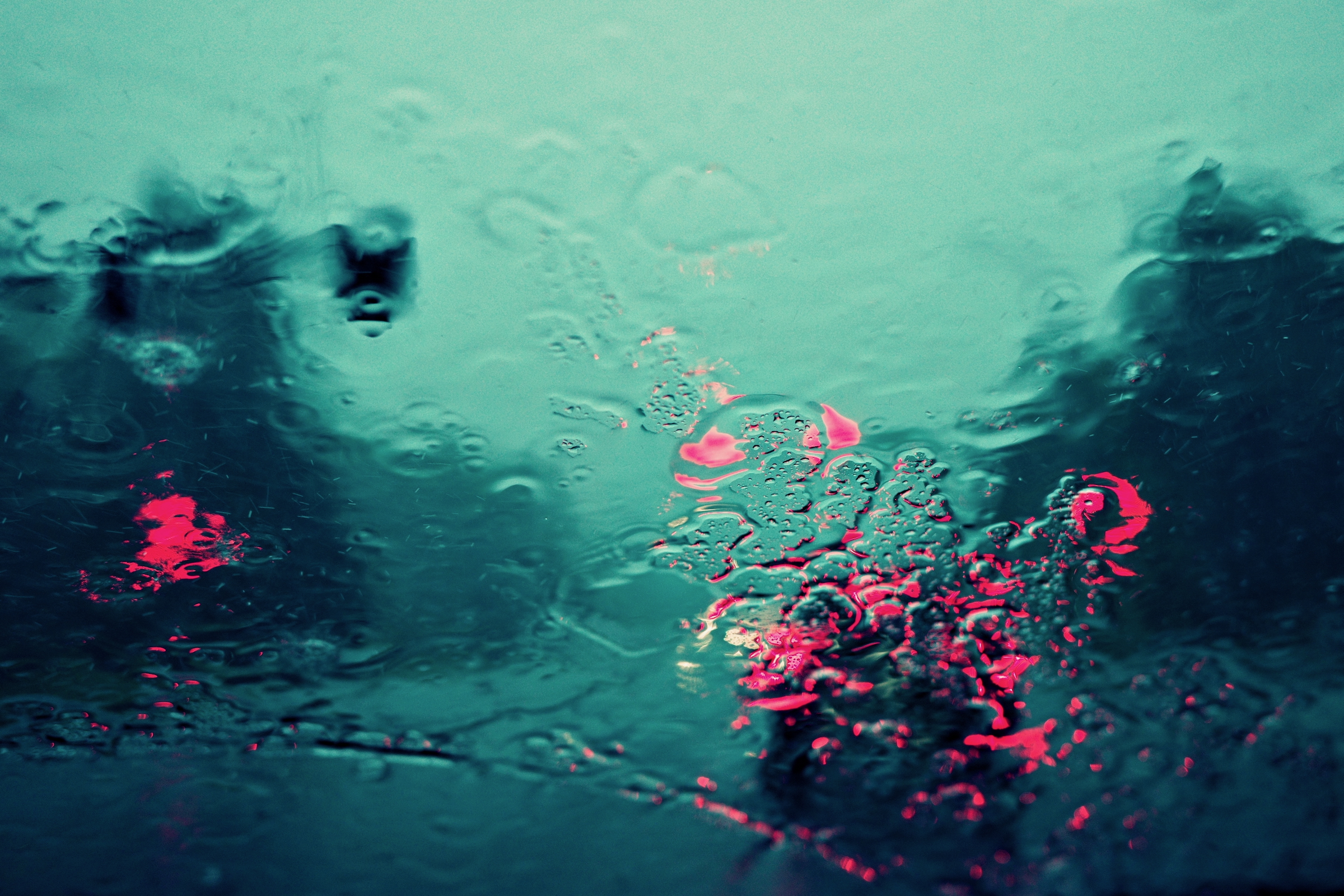 Cars and stoplight through a windshield