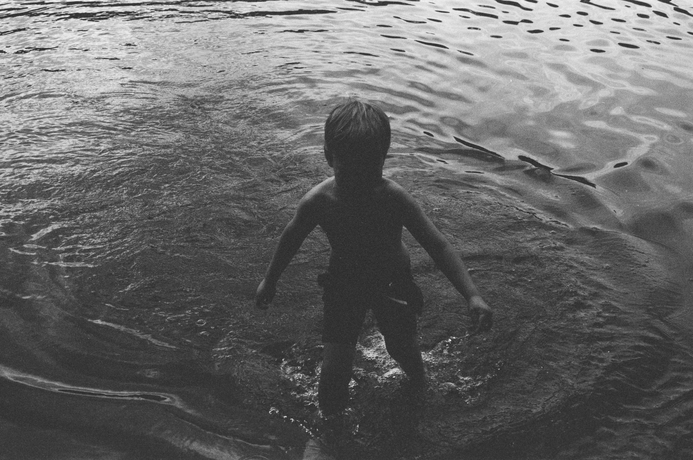 Boy leaving the lake