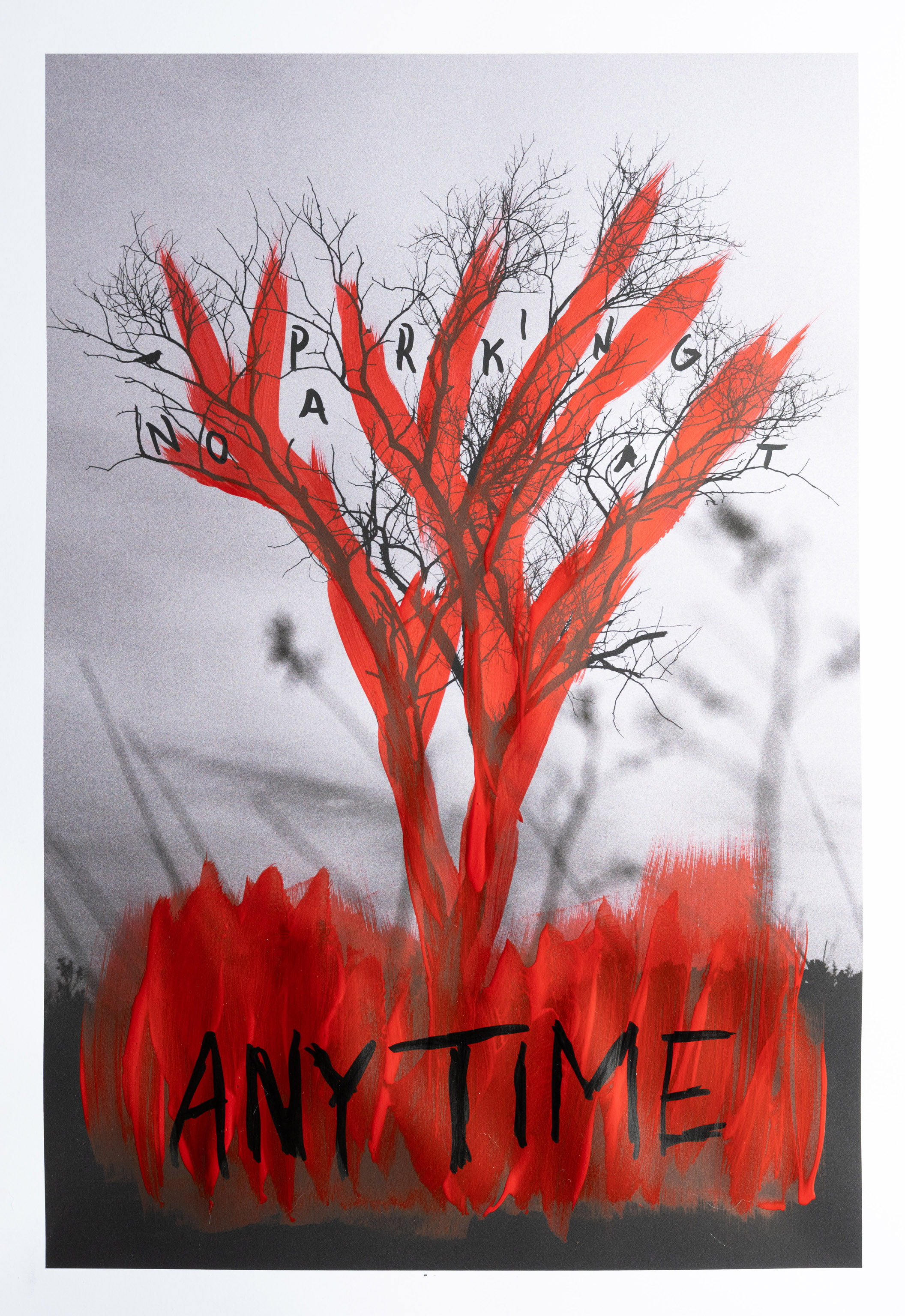 Tree with paint and writing on it